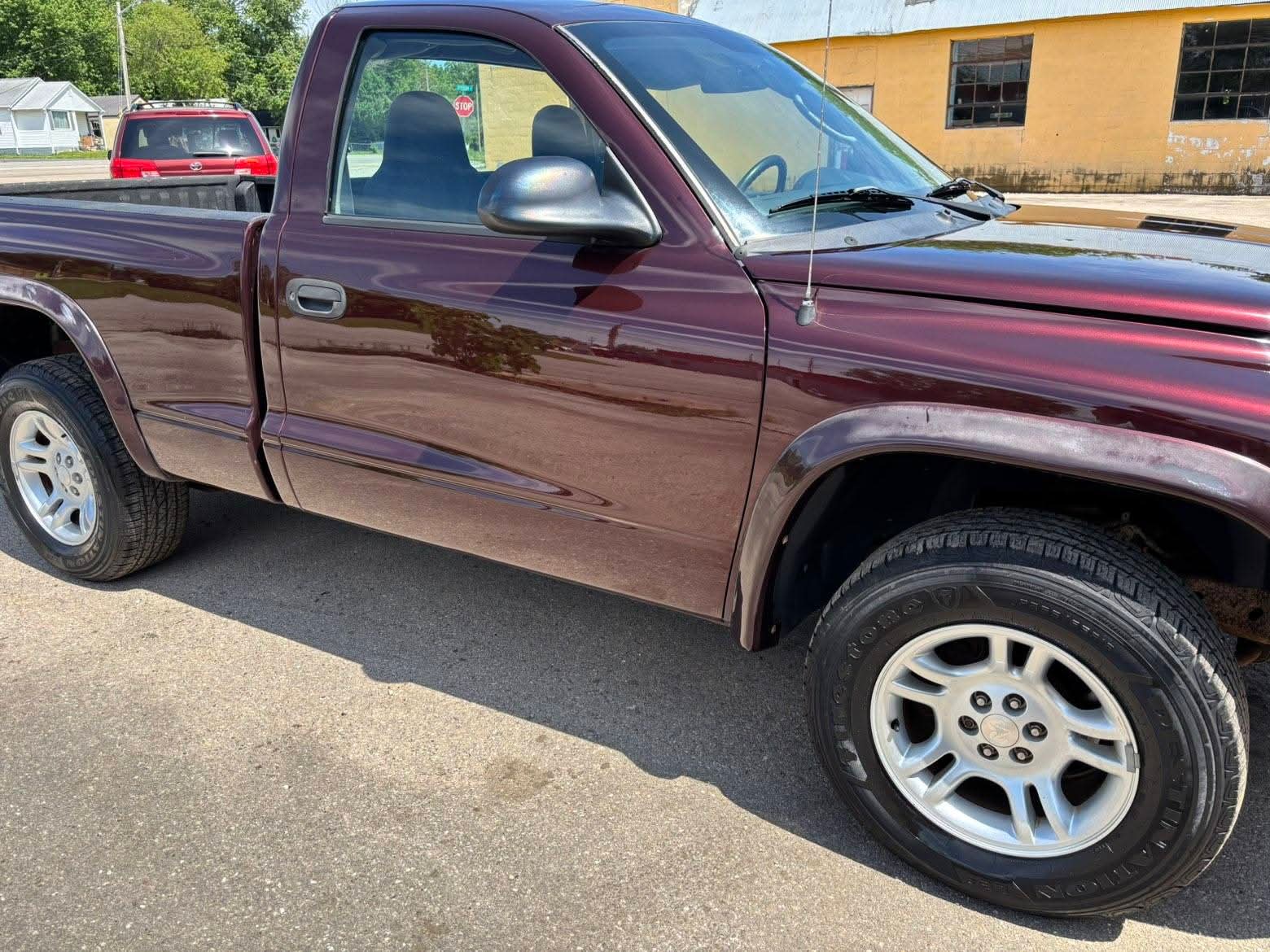 Maroon pickup truck after exterior detailing
